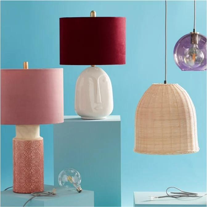 Table lamps and pendant lamps on display. Different types of lighting available. Exclusive lighting from Drew Barrymore Flower Home. 